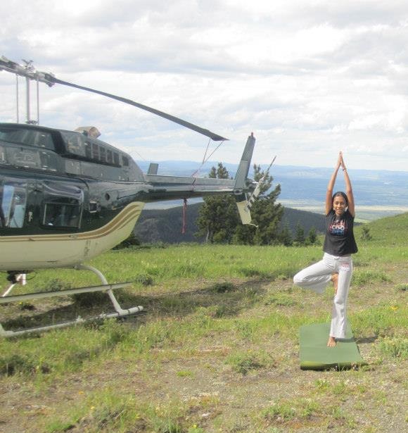 That's me striking a yoga pose next to the helicopter that transported us.